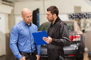 Image showing auto mechanic and customer at car shop