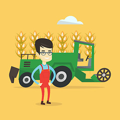 Image showing Farmer standing with combine on background.