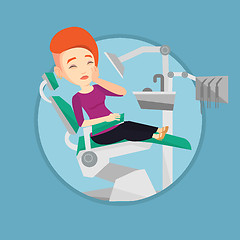 Image showing Woman suffering in dental chair.