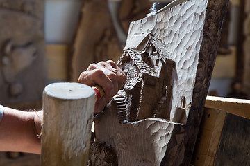 Image showing Sculptor hands working wood