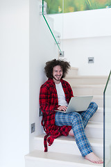 Image showing freelancer in bathrobe working from home