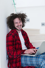 Image showing freelancer in bathrobe working from home