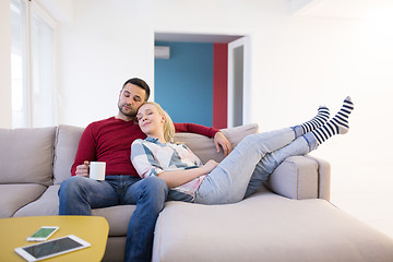 Image showing couple hugging and relaxing on sofa