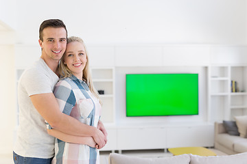 Image showing couple hugging in their new home