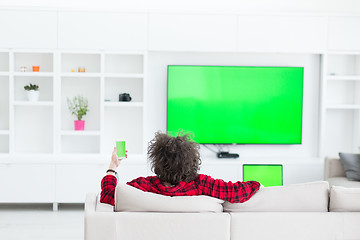 Image showing young man in bathrobe enjoying free time