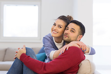 Image showing couple hugging and relaxing on sofa