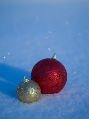 Image showing christmas balls decoration in snow