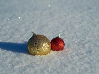 Image showing christmas balls decoration in snow