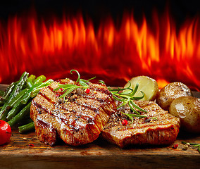 Image showing freshly grilled steaks and vegetables