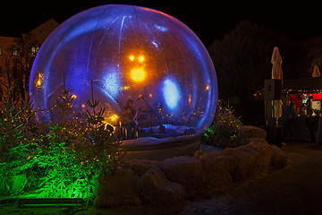 Image showing Christmas snow globe in which the flute player as part of Advent