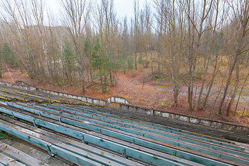 Image showing Overgrown stadium in ghost city Pripyat.