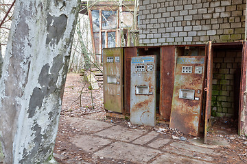 Image showing Broken refreshments drinks machines in overgrown ghost city Pripyat.