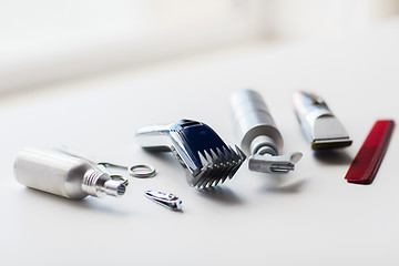 Image showing styling hair sprays, clippers, comb and scissors