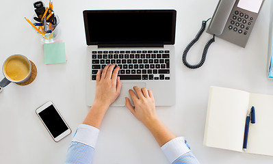 Image showing hands of businesswoman working on laptop at office