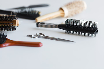 Image showing scissors and different hair brushes