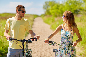 Image showing happy couple with bicycles on country road