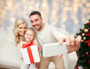 Image showing family taking selfie with smartphone at christmas