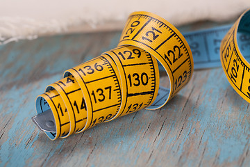 Image showing Retro sewing accessories on blue wooden background