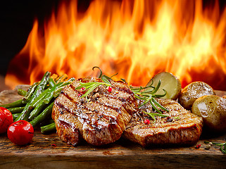 Image showing freshly grilled steaks and vegetables