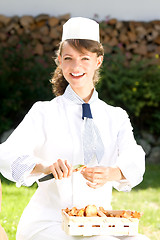 Image showing female chef with chanterelle mushrooms, 