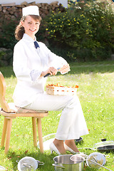 Image showing female chef with chanterelle mushrooms,