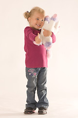 Image showing Positive girl with cuddly toy