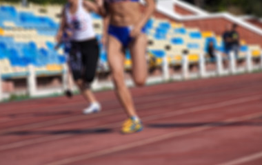 Image showing Blurred view of athletic running competition at stadium not in f