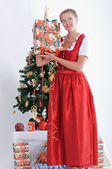 Image showing Young woman in traditional costume at christmas