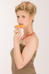 Image showing Smiling Woman Eating orange