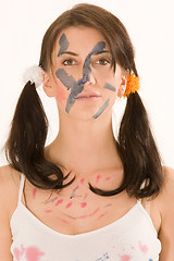 Image showing Young woman with paint on his face