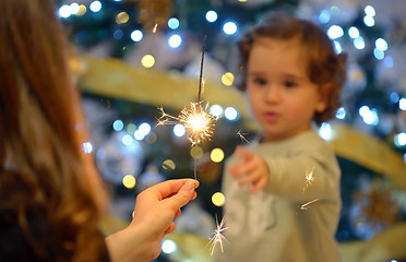 Image showing Teen girl holding sparklers