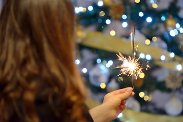 Image showing Teen girl holding sparklers