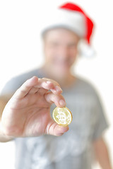 Image showing Man holding a Bitcoin digital currency  cryptocurrency