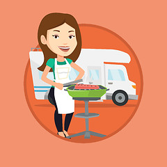 Image showing Woman having barbecue in front of camper van.