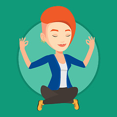 Image showing Businesswoman meditating in lotus position.