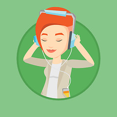 Image showing Young woman in headphones listening to music.