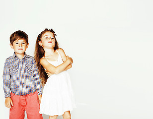 Image showing little cute boy and girl hugging playing on white background, ha