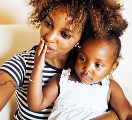 Image showing adorable sweet young afro-american mother with cute little daugh