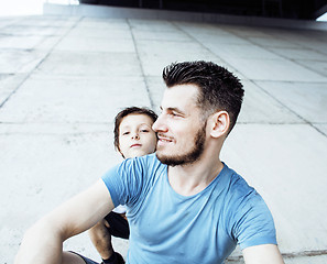 Image showing young pretty man model with little cute son playing together, li