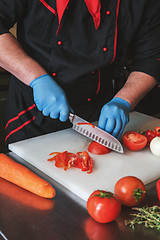 Image showing Chef cutting vegetables