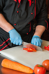 Image showing Chef cutting vegetables