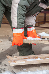 Image showing Carpenter working at sawmill