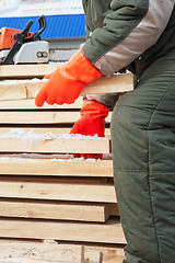 Image showing Carpenter working at sawmill