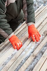 Image showing Carpenter working at sawmill