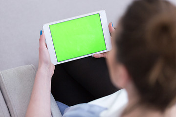 Image showing woman on sofa using tablet computer