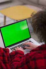 Image showing man freelancer in bathrobe working from home