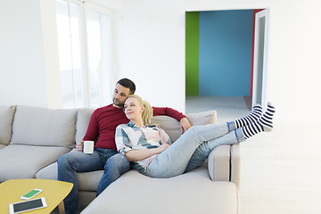 Image showing couple hugging and relaxing on sofa