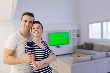 Image showing couple hugging in their new home