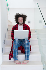 Image showing freelancer in bathrobe working from home