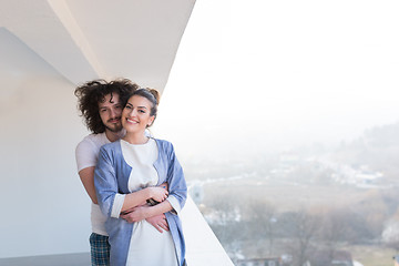 Image showing Couple hugging on the balcony